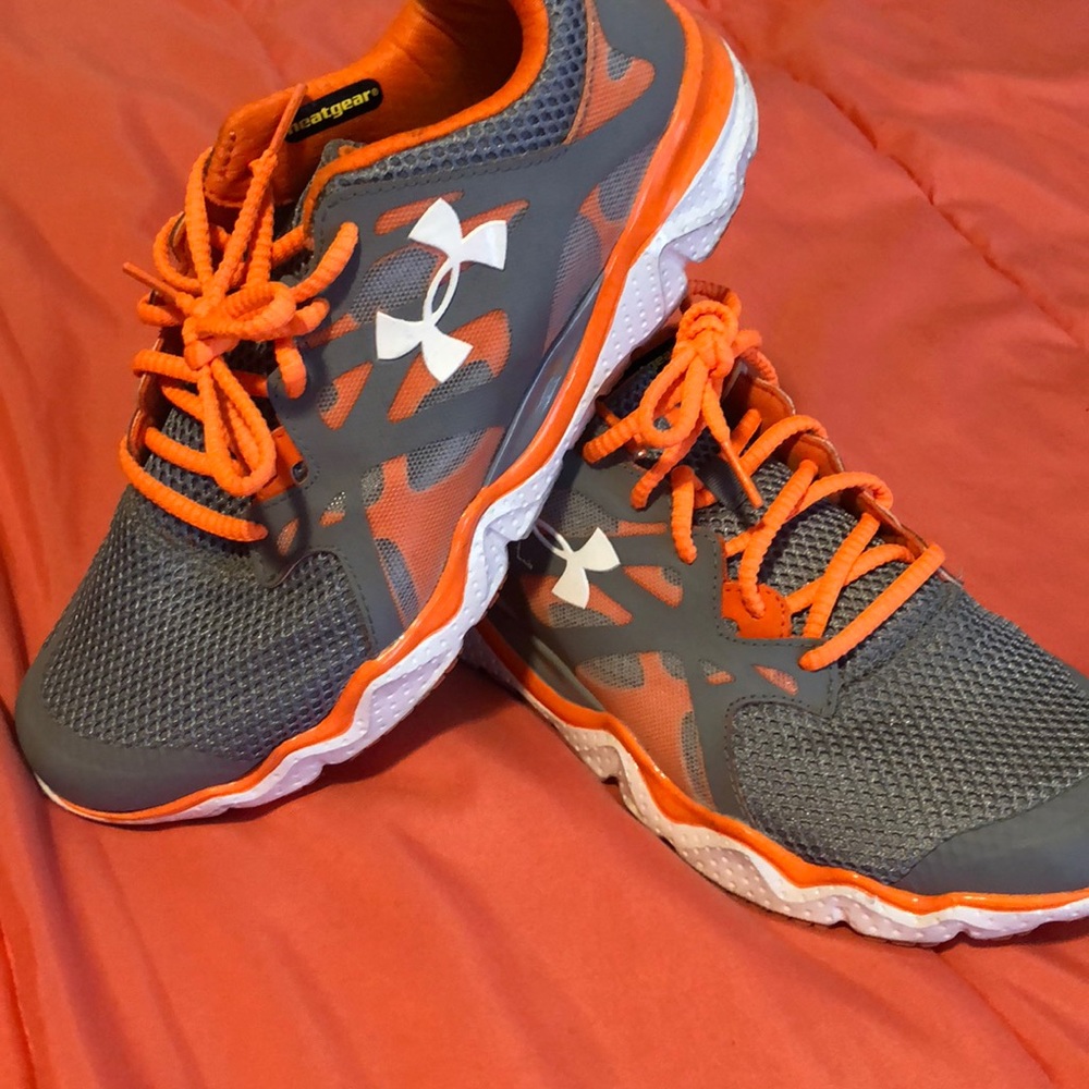 Under armor grey and orange sneakers.